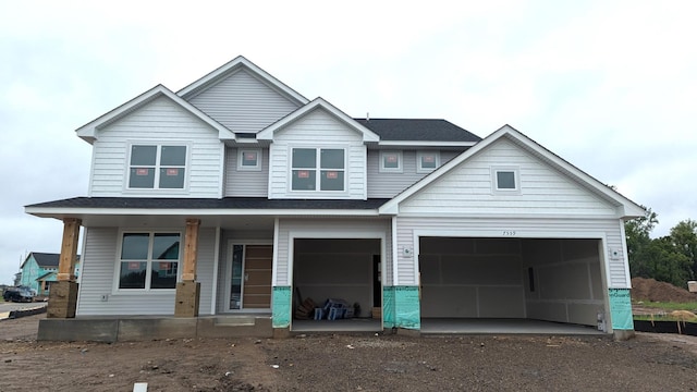 7559 Upper 42nd St N, Oakdale, MN 55128 - view of front of home featuring covered porch and driveway