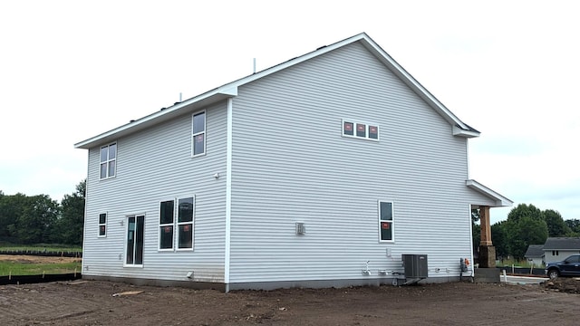 7559 Upper 42nd St N, Oakdale, MN 55128 - view of side of home with a central air condition unit