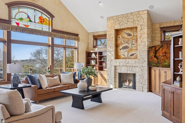 12159 Quail Avenue Ln N, Stillwater, MN 55082 - living room featuring high vaulted ceiling, light carpet, plenty of natural light, and a fireplace