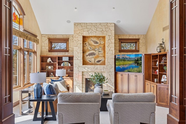 12159 Quail Avenue Ln N, Stillwater, MN 55082 - living area with healthy amount of natural light, a fireplace, and high vaulted ceiling