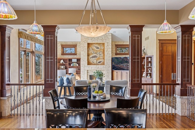 12159 Quail Avenue Ln N, Stillwater, MN 55082 - dining room featuring ornate columns and wood finished floors