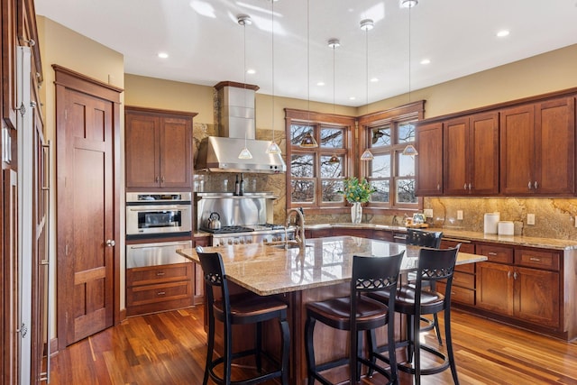 12159 Quail Avenue Ln N, Stillwater, MN 55082 - kitchen featuring a warming drawer, a sink, wall chimney range hood, dark wood-style flooring, and recessed lighting