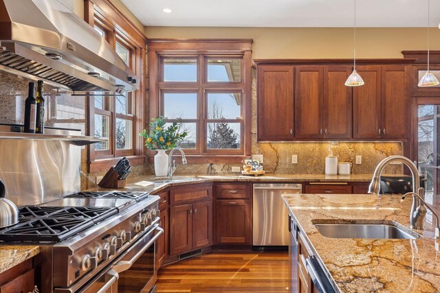 12159 Quail Avenue Ln N, Stillwater, MN 55082 - kitchen featuring exhaust hood, appliances with stainless steel finishes, a sink, hanging light fixtures, and recessed lighting