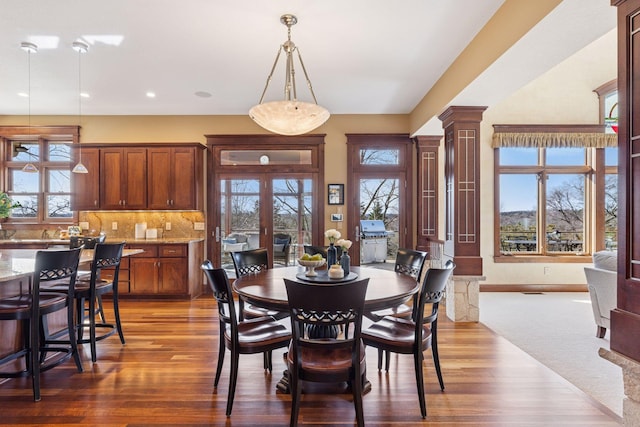 12159 Quail Avenue Ln N, Stillwater, MN 55082 - dining space featuring ornate columns, plenty of natural light, wood finished floors, recessed lighting, and french doors