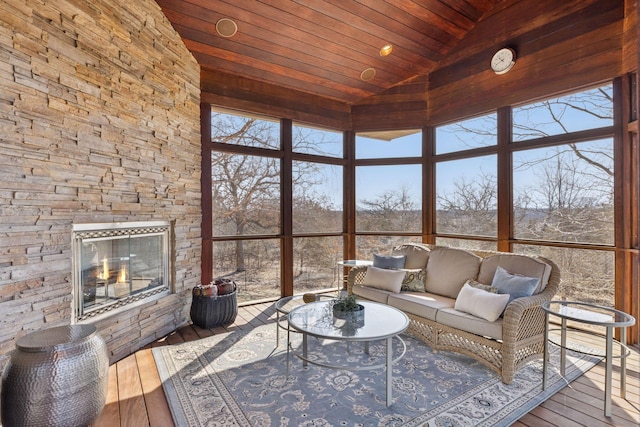 12159 Quail Avenue Ln N, Stillwater, MN 55082 - sunroom / solarium featuring wooden ceiling, hardwood / wood-style floors, a wooden deck, an outdoor living space with a fireplace, and high vaulted ceiling