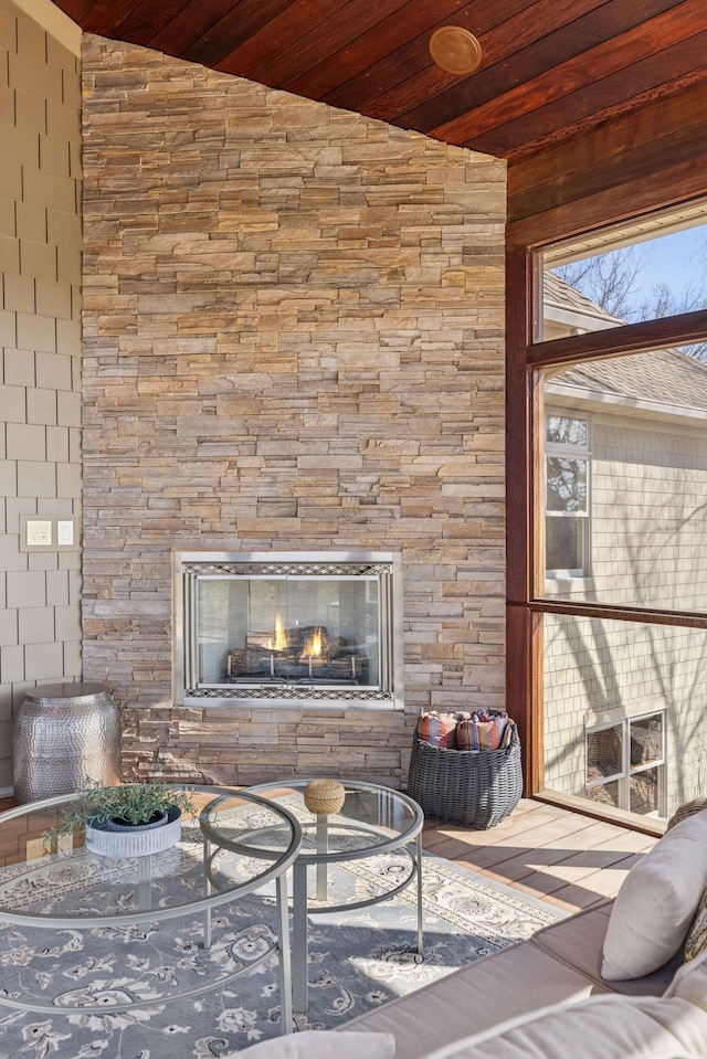 12159 Quail Avenue Ln N, Stillwater, MN 55082 - living room with wooden ceiling, vaulted ceiling, and a stone fireplace
