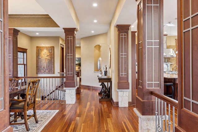 12159 Quail Avenue Ln N, Stillwater, MN 55082 - hallway with decorative columns, hardwood / wood-style floors, an upstairs landing, baseboards, and recessed lighting