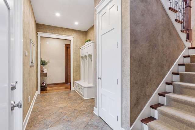 12159 Quail Avenue Ln N, Stillwater, MN 55082 - foyer featuring baseboards, stairs, light stone finish flooring, and recessed lighting