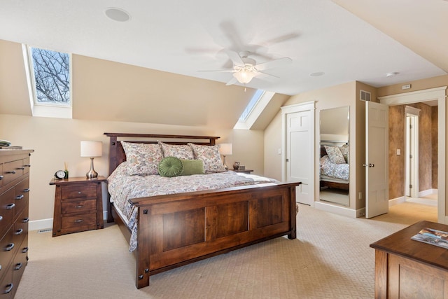 12159 Quail Avenue Ln N, Stillwater, MN 55082 - bedroom featuring a skylight, light carpet, a ceiling fan, and baseboards