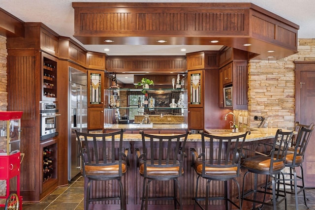 12159 Quail Avenue Ln N, Stillwater, MN 55082 - indoor wet bar with appliances with stainless steel finishes and recessed lighting