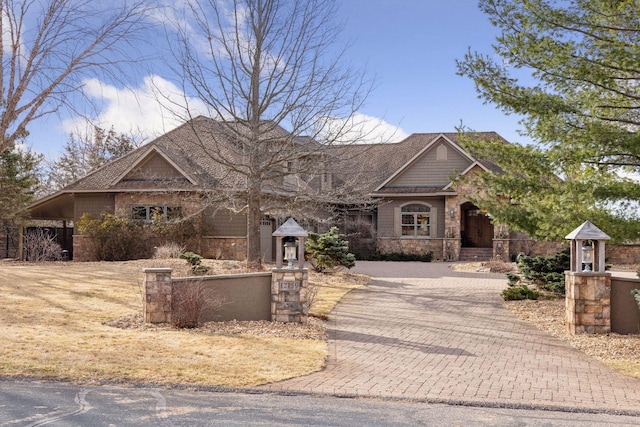 12159 Quail Avenue Ln N, Stillwater, MN 55082 - craftsman-style house with stone siding and decorative driveway
