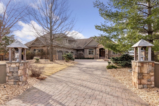 12159 Quail Avenue Ln N, Stillwater, MN 55082 - view of front of house with stone siding and decorative driveway