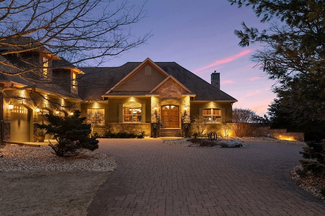 12159 Quail Avenue Ln N, Stillwater, MN 55082 - view of front of property with a chimney, stone siding, and curved driveway