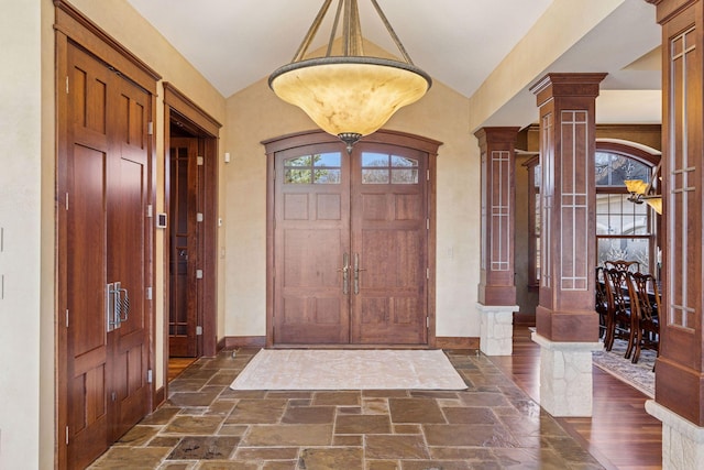 12159 Quail Avenue Ln N, Stillwater, MN 55082 - entryway with decorative columns, vaulted ceiling, stone tile flooring, and baseboards