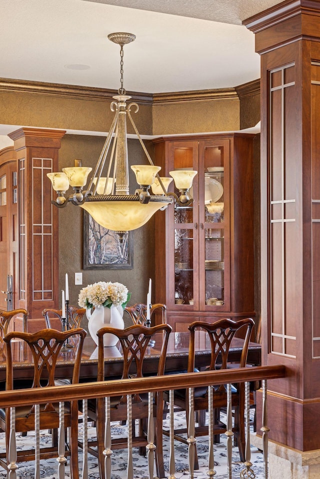12159 Quail Avenue Ln N, Stillwater, MN 55082 - dining room with a chandelier, crown molding, and a textured wall