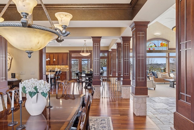 12159 Quail Avenue Ln N, Stillwater, MN 55082 - dining area featuring ornate columns, dark wood finished floors, plenty of natural light, french doors, and crown molding