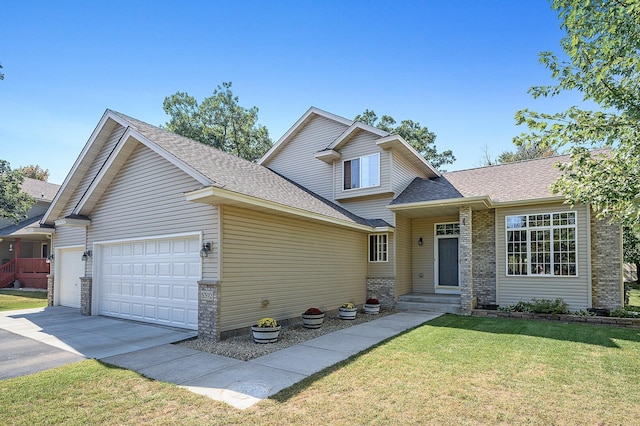 5392 Highland Trl, Big Lake, MN 55309 - view of front facade featuring an attached garage, concrete driveway, a front lawn, and a shingled roof