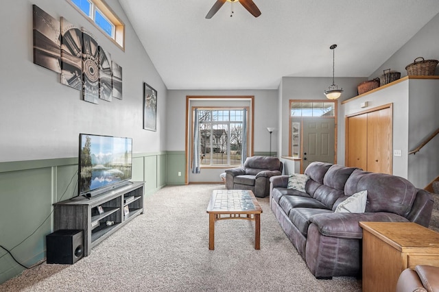 5392 Highland Trl, Big Lake, MN 55309 - carpeted living room with a ceiling fan, a wainscoted wall, and lofted ceiling