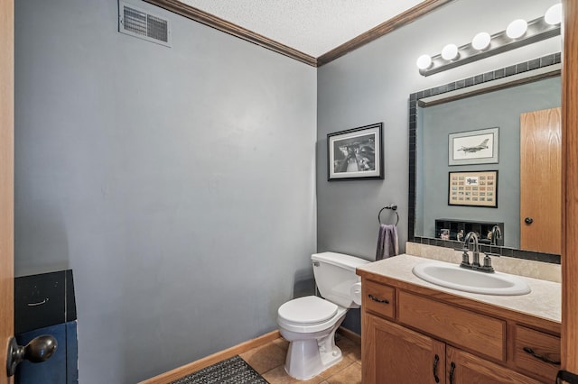 5392 Highland Trl, Big Lake, MN 55309 - bathroom featuring ornamental molding, toilet, tile patterned floors, vanity, and a textured ceiling