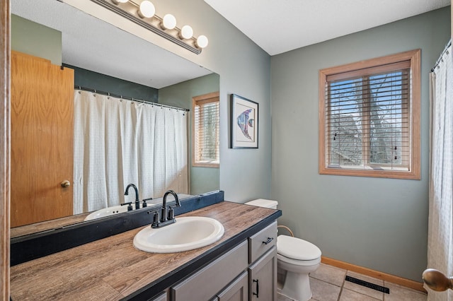 5392 Highland Trl, Big Lake, MN 55309 - full bathroom with tile patterned flooring, vanity, toilet, and baseboards