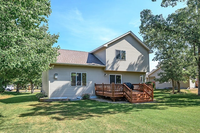 5392 Highland Trl, Big Lake, MN 55309 - rear view of property featuring a lawn, a deck, and roof with shingles