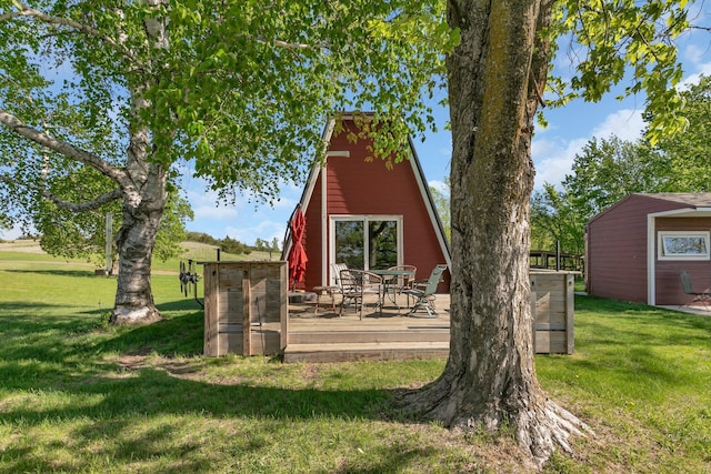 19663 County Road 9 NE, New London Twp, MN 56273 - back of property featuring a wooden deck and a lawn