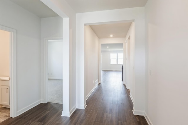 11452 Queens Ct N, Lake Elmo, MN 55042 - hallway with dark wood-style floors and baseboards