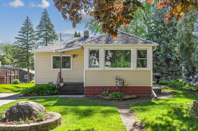 926 Bellows St, West Saint Paul, MN 55118 - bungalow-style house with a front yard, a chimney, and roof with shingles