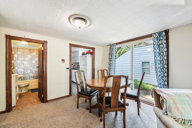 926 Bellows St, West Saint Paul, MN 55118 - dining room featuring light carpet and baseboards