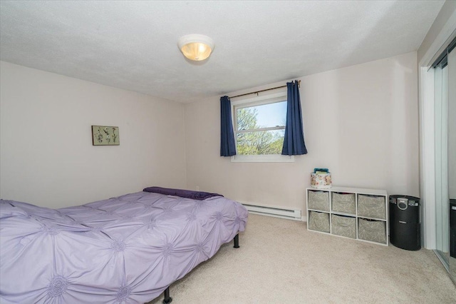 3003 Hammond Ave, Superior, WI 54880 - carpeted bedroom featuring baseboard heating