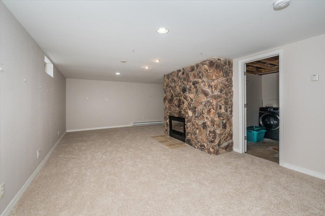 3003 Hammond Ave, Superior, WI 54880 - unfurnished living room featuring washer / clothes dryer, baseboard heating, carpet flooring, a fireplace, and recessed lighting