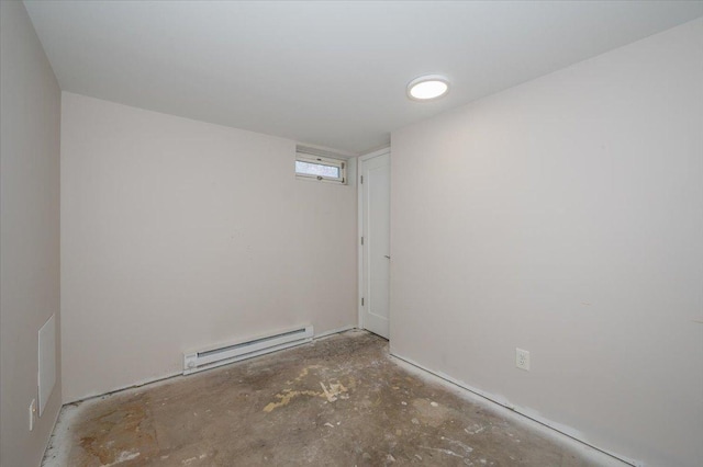 3003 Hammond Ave, Superior, WI 54880 - unfurnished room featuring a baseboard radiator and unfinished concrete floors