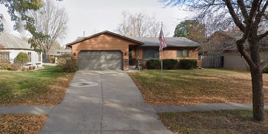 1524 31st Ave N, Saint Cloud, MN 56303 - ranch-style home with an attached garage, concrete driveway, and a front yard