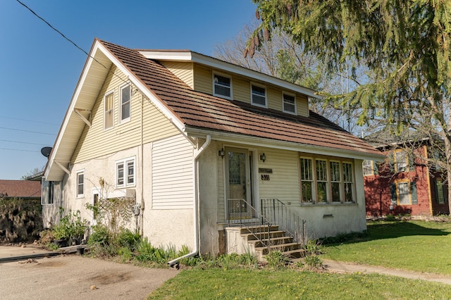 339 Cherry St E, Mazeppa, MN 55956 - view of front of property featuring a front yard and stucco siding