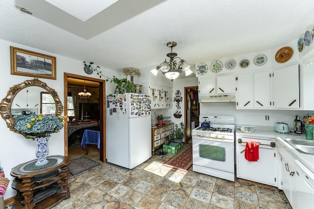 339 Cherry St E, Mazeppa, MN 55956 - kitchen featuring a chandelier, white appliances, under cabinet range hood, light countertops, and white cabinets
