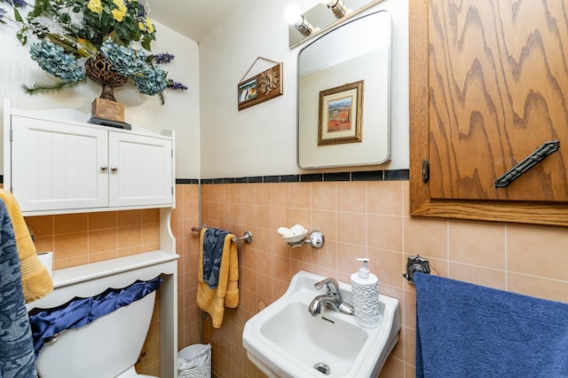 339 Cherry St E, Mazeppa, MN 55956 - half bath with a sink, tile walls, and toilet