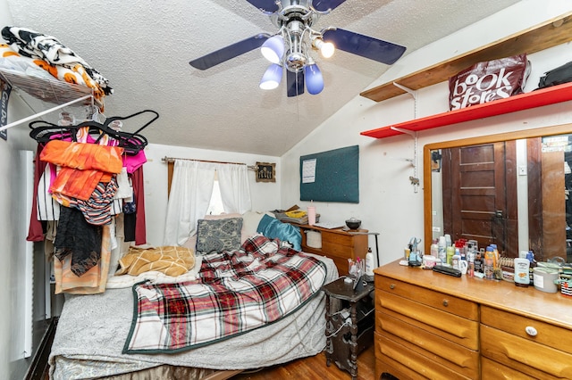 339 Cherry St E, Mazeppa, MN 55956 - bedroom featuring a textured ceiling, lofted ceiling, wood finished floors, and ceiling fan