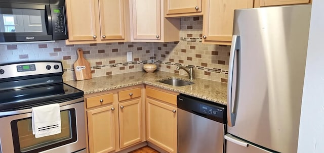 3155 Coachman Rd Unit 350, Eagan, MN 55121 - kitchen with stainless steel appliances, backsplash, and light stone counters
