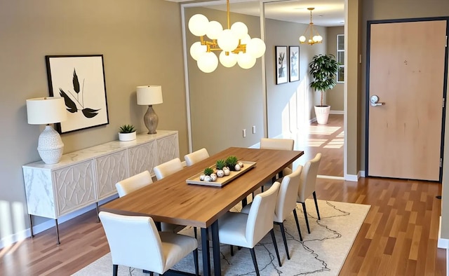 3155 Coachman Rd Unit 350, Eagan, MN 55121 - dining room featuring a chandelier and wood finished floors