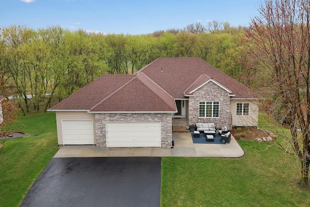 4828 Mason Ave NE, Saint Michael, MN 55376 - view of front of house featuring stone siding, an outdoor living space, driveway, a garage, and a front yard