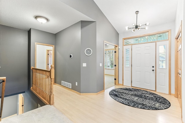 4828 Mason Ave NE, Saint Michael, MN 55376 - entryway with wood finished floors, a chandelier, and baseboards