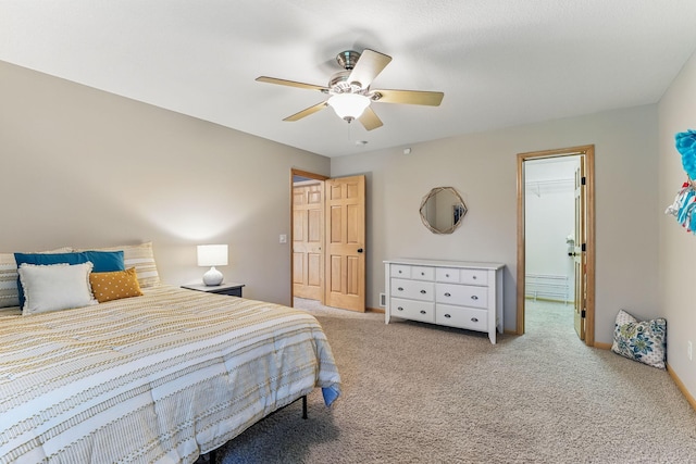 4828 Mason Ave NE, Saint Michael, MN 55376 - carpeted bedroom with ceiling fan and a walk in closet