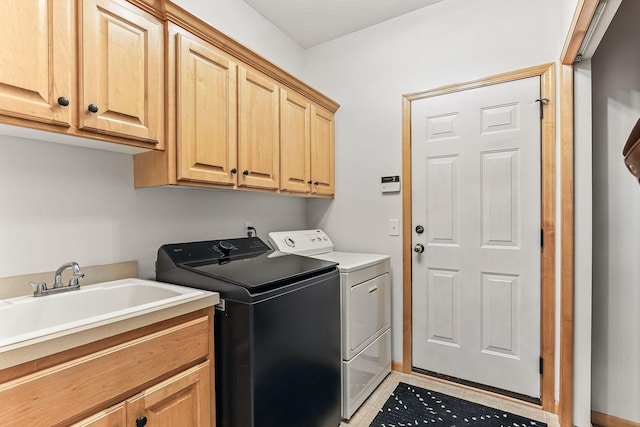 4828 Mason Ave NE, Saint Michael, MN 55376 - laundry area featuring washer and clothes dryer, cabinet space, and light tile patterned flooring