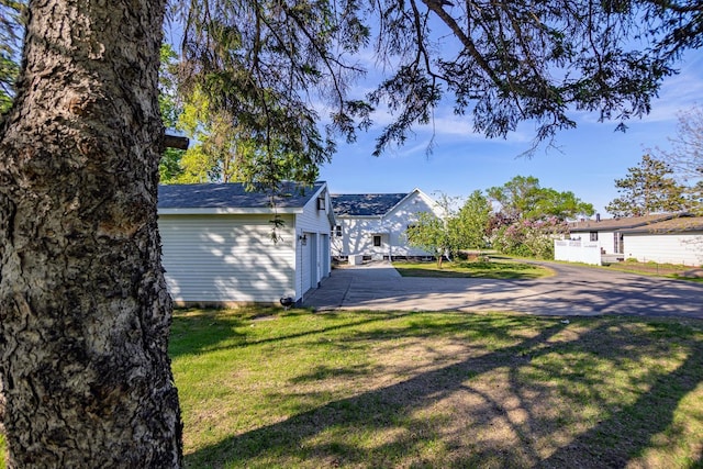 546 2nd St SE, Perham, MN 56573 - view of property exterior with a yard and a garage