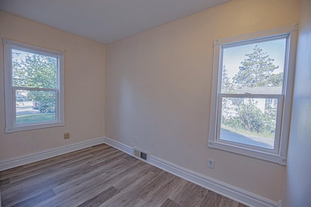 546 2nd St SE, Perham, MN 56573 - unfurnished room featuring wood finished floors and baseboards