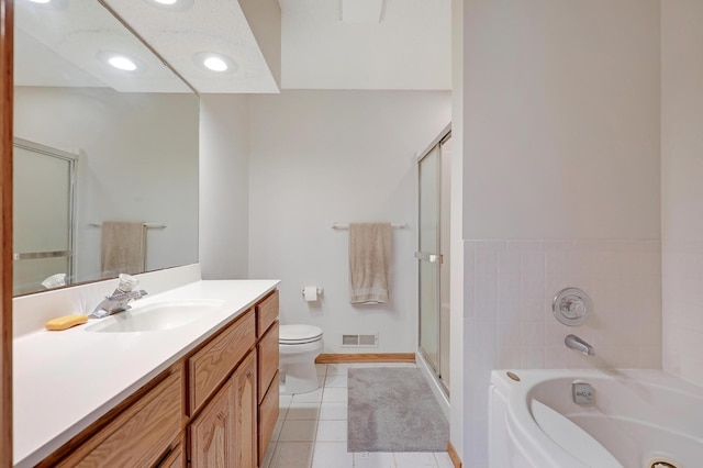 full bathroom featuring vanity, tile patterned flooring, a stall shower, a bath, and toilet
