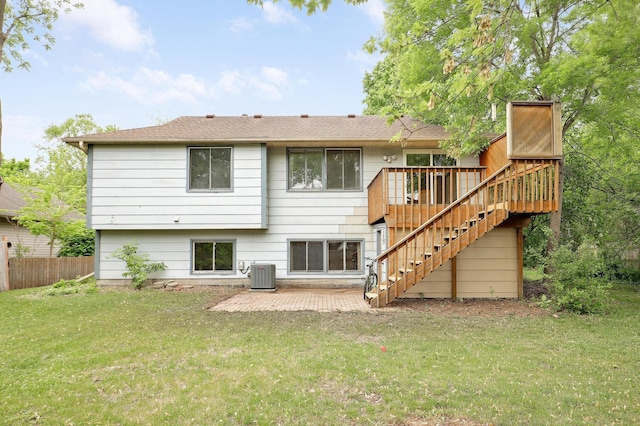 rear view of property featuring stairway, central AC unit, a patio, and a wooden deck