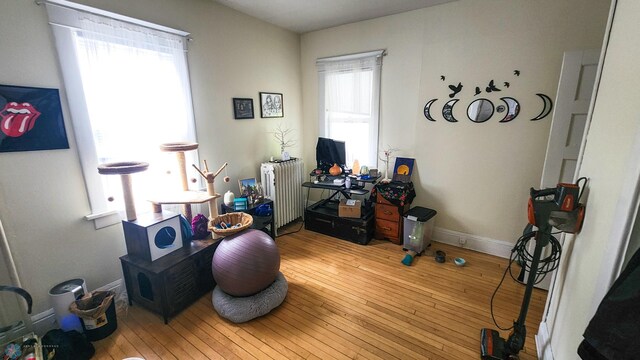 728 8th St N, Fargo, ND 58102 - miscellaneous room with radiator, plenty of natural light, hardwood / wood-style floors, and baseboards