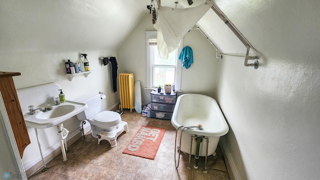 728 8th St N, Fargo, ND 58102 - full bathroom with radiator heating unit, lofted ceiling, toilet, baseboards, and a bath