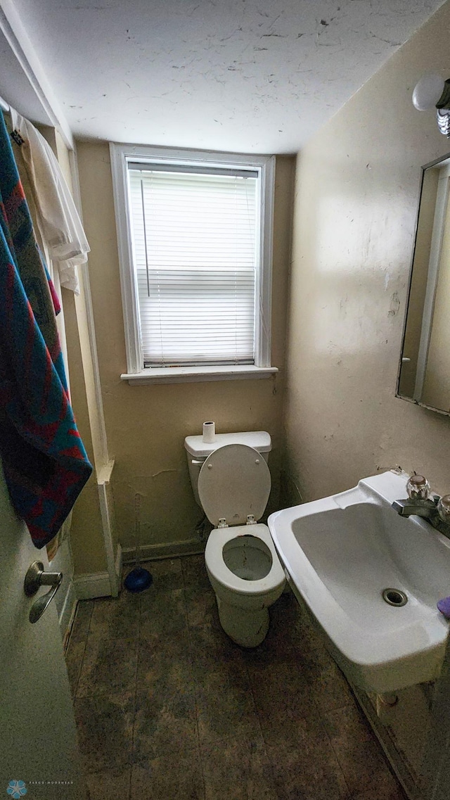 728 8th St N, Fargo, ND 58102 - bathroom with a sink and toilet